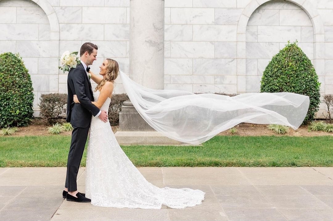 Bride and Groom have a first look with veil floating in the wind. Midtown Atlanta, Ga.